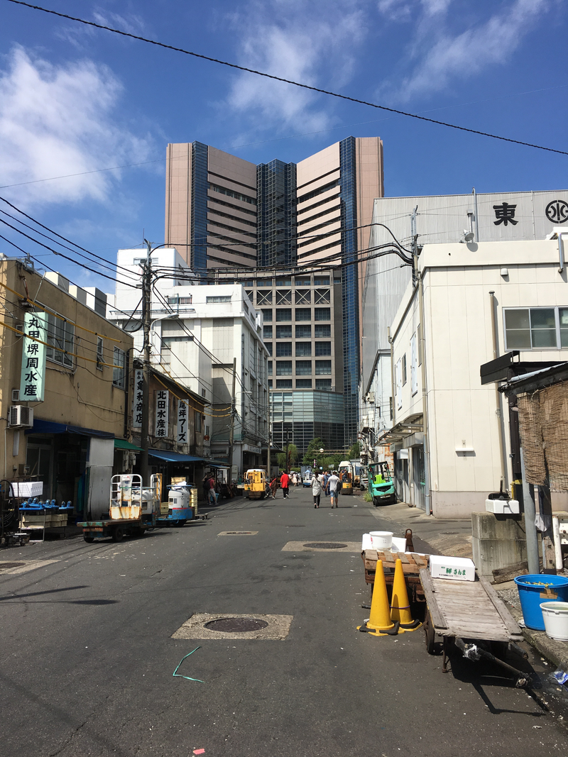 A contemporary building towers of the inner market’s outskirts.